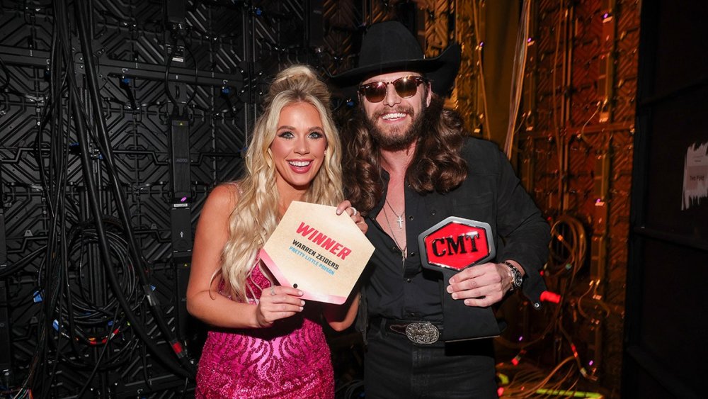 Country star Warren Zeiders smiles next to Megan Moroney at CMT Music Awards