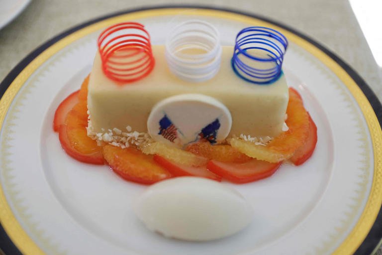 The dessert for the White House state dinner for France on Dec. 1, 2022, was orange chiffon cake with roasted pears with citrus sauce and crème fraiche ice cream.