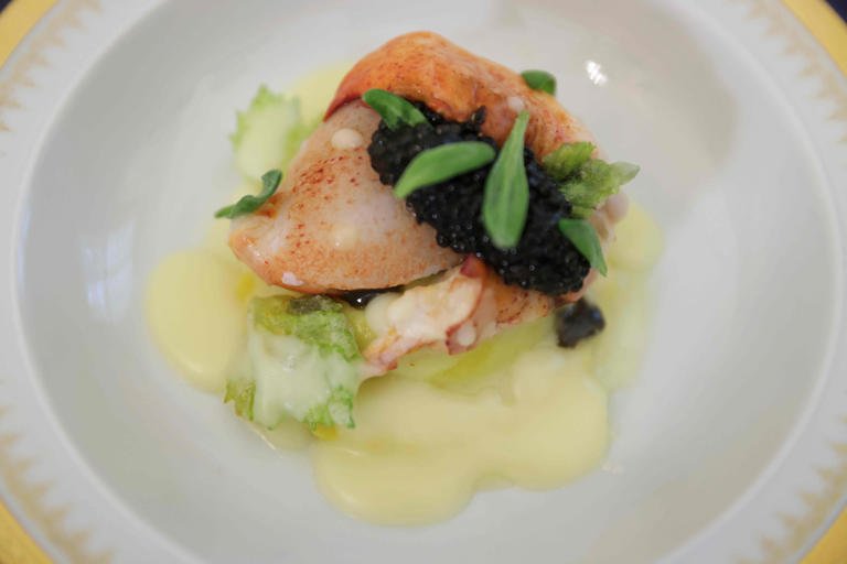 Butter-poached Maine Lobster with American Osetra Caviar, Delicata squash raviolo with and tarragon sauce were served at the state dinner for France on Dec. 1, 2022.