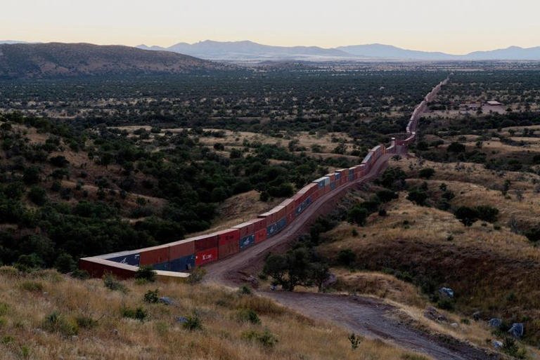 Shipping containers form the border wall on the frontier with Mexico in Cochise County