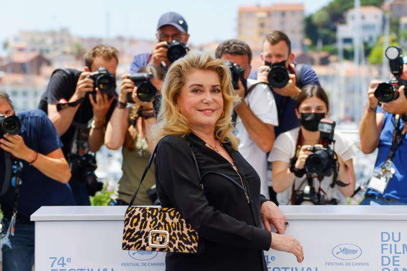 Catherine Deneuve et al. standing in front of a crowd: The 74th Cannes Film Festival - Photocall for the film "De son vivant" Out of Competition