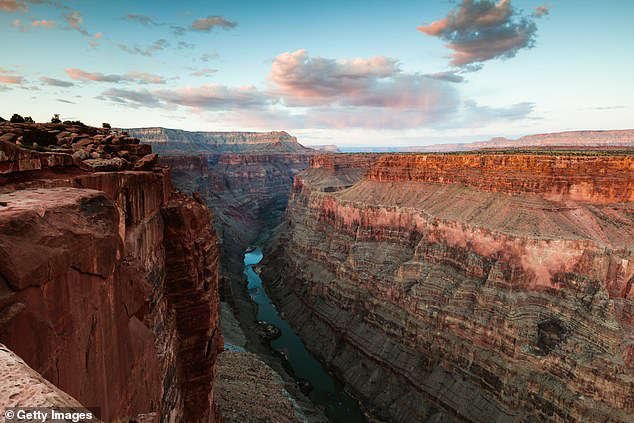 a canyon with a mountain in the background: (