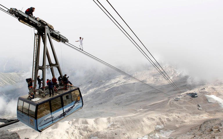 Nock balances on the ropeway of a cable car on Germany's highest mountain, Zugspitze, in 2011 - Michaela Rehle/Reuters