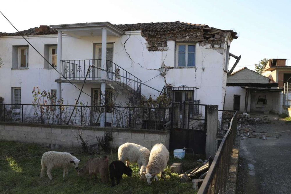 Damage is seen on a house after an earthquake in Mesochori village, central Greece, Wednesday, March 3, 2021. An earthquake with a preliminary magnitude of at least 6.0 struck central Greece Wednesday and was also felt in neighboring Albania and North Macedonia, and as far as Kosovo and Montenegro.
