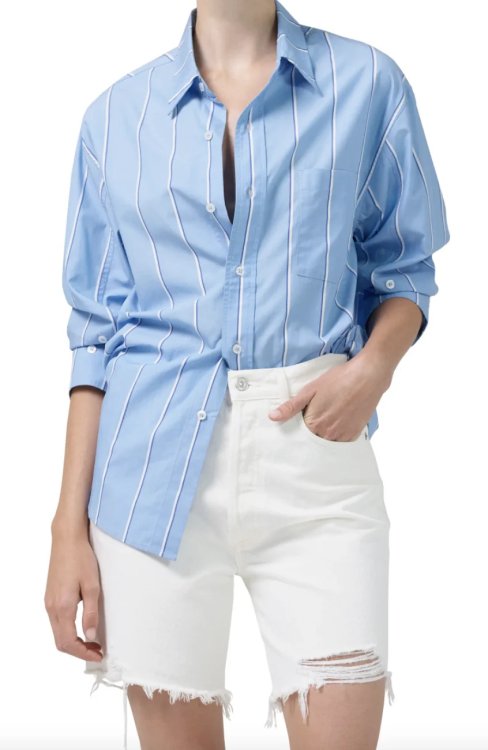 model in white denim bermuda shorts and blue striped Citizens of Humanity Kayla Long Sleeve Button-Up Shirt (Photo via Nordstrom)
