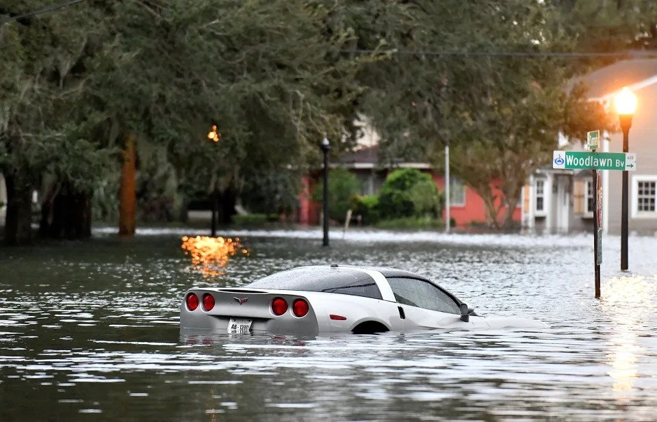 A car floating in Hurricane Ian's floodwaters in Orlando.