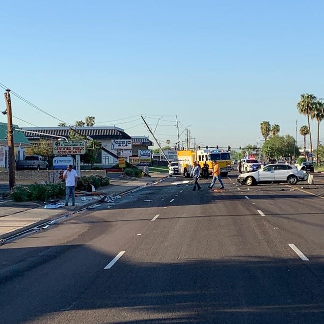 A box truck crashed into power poles and a business, causing a fuel leak, on Sept. 2, 2022, in Glendale.